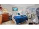 Comfortable bedroom featuring a well-made bed, classic dresser, and decorative maritime accents at 4648 Greenbriar Dr. # D2, Little River, SC 29566