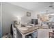 Functional dining area with modern decor, seating for four, and bright flooring at 4648 Greenbriar Dr. # D2, Little River, SC 29566
