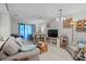 Comfortable living room with modern furniture, bright natural light, and airy feel at 4648 Greenbriar Dr. # D2, Little River, SC 29566