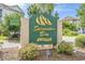 Community entrance sign for Spinnaker Bay at Eastport with lush landscaping and manicured bushes at 4648 Greenbriar Dr. # D2, Little River, SC 29566
