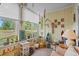 Airy sunroom adorned with plants, nautical décor, and large windows offering outdoor views at 4648 Greenbriar Dr. # D2, Little River, SC 29566