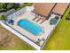 Aerial view of in-ground pool, patio, hot tub, well-maintained backyard, and manicured lawn at 502 Garden Dr., Surfside Beach, SC 29575