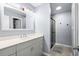 Modern bathroom with a sleek vanity, shower, and neutral color scheme for a serene and stylish space at 502 Garden Dr., Surfside Beach, SC 29575