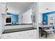 Open layout kitchen with bar seating next to a dining room set at 502 Garden Dr., Surfside Beach, SC 29575