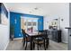 Stylish dining room featuring a contemporary table, chairs, and vibrant blue accent wall creating an inviting atmosphere at 502 Garden Dr., Surfside Beach, SC 29575