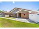 Charming home exterior with a brick facade, manicured lawn, and inviting entryway, offering curb appeal at 502 Garden Dr., Surfside Beach, SC 29575