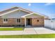 Charming brick home featuring a covered entrance and well-manicured lawn at 502 Garden Dr., Surfside Beach, SC 29575