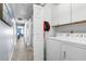 Functional laundry area with a washer and dryer, cabinets, and ample storage space for convenience at 502 Garden Dr., Surfside Beach, SC 29575
