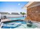 Backyard pool featuring a hot tub, lounge chairs, and privacy fence at 502 Garden Dr., Surfside Beach, SC 29575
