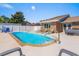 Refreshing in-ground pool with tanning deck, seating and spa with a well-maintained brick home at 502 Garden Dr., Surfside Beach, SC 29575