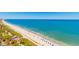 An aerial view of an ocean front beach with blue umbrellas and ocean view at 504 N Ocean Blvd. # 1804 A/B, Myrtle Beach, SC 29577