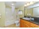 Bathroom features a shower/tub combo, vanity with granite countertop, and neutral tile flooring at 504 N Ocean Blvd. # 1804 A/B, Myrtle Beach, SC 29577
