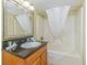 Bathroom featuring a vanity, mirror, and a shower/tub combination with a curtain at 504 N Ocean Blvd. # 1804 A/B, Myrtle Beach, SC 29577