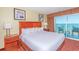 Bedroom featuring a comfortable king bed and a balcony with views of the ocean at 504 N Ocean Blvd. # 1804 A/B, Myrtle Beach, SC 29577