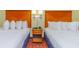 Comfortable bedroom featuring two beds with lamps and a nightstand between them at 504 N Ocean Blvd. # 1804 A/B, Myrtle Beach, SC 29577