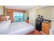 Bedroom with sliding glass doors to balcony, mini bar, dresser and cozy decor at 504 N Ocean Blvd. # 1804 A/B, Myrtle Beach, SC 29577