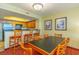 Bright kitchen with wooden cabinets, a breakfast bar, and a dining table with seating at 504 N Ocean Blvd. # 1804 A/B, Myrtle Beach, SC 29577