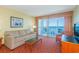 Relaxing living room featuring a sofa, armchair, and a scenic ocean view from the balcony at 504 N Ocean Blvd. # 1804 A/B, Myrtle Beach, SC 29577