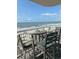 Ocean view from balcony with comfortable seating and room for entertaining at 523 S Ocean Blvd. # 705, North Myrtle Beach, SC 29582