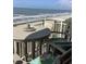 Inviting balcony with outdoor seating, perfect for enjoying ocean views and fresh air at 523 S Ocean Blvd. # 705, North Myrtle Beach, SC 29582