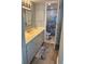 Well-lit bathroom featuring a marble countertop and decorative shower curtain at 523 S Ocean Blvd. # 705, North Myrtle Beach, SC 29582