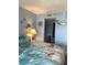 Comfortable bedroom with ocean-themed décor and a glimpse into the bathroom at 523 S Ocean Blvd. # 705, North Myrtle Beach, SC 29582