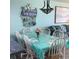 Charming dining area with seating for six, adjacent to the cozy living space at 523 S Ocean Blvd. # 705, North Myrtle Beach, SC 29582
