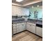 Bright kitchen with granite counters, modern appliances, and coastal-themed decorations at 523 S Ocean Blvd. # 705, North Myrtle Beach, SC 29582