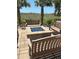 Enjoy the cozy patio with a fire pit, comfortable seating, and palm trees, perfect for relaxing and entertaining at 523 S Ocean Blvd. # 705, North Myrtle Beach, SC 29582