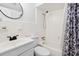 Well-lit bathroom featuring a shower-tub combo, toilet, sink, and black matte fixtures at 5409 North Ocean Blvd. # 106/7108, North Myrtle Beach, SC 29582