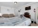 Bright bedroom with queen bed, loveseat, dresser, microwave, and wall-mounted TV at 5409 North Ocean Blvd. # 106/7108, North Myrtle Beach, SC 29582