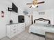Cozy bedroom with a wicker headboard, tile floors, and a convenient mini-fridge at 5409 North Ocean Blvd. # 106/7108, North Myrtle Beach, SC 29582