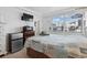 Cozy bedroom features a comfortable bed, mini-fridge, and a TV at 5409 North Ocean Blvd. # 106/7108, North Myrtle Beach, SC 29582