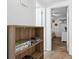 Hallway featuring storage shelves and leading to a bedroom at 5409 North Ocean Blvd. # 106/7108, North Myrtle Beach, SC 29582