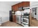 Efficient kitchen with stainless steel appliances and wood cabinetry at 5409 North Ocean Blvd. # 106/7108, North Myrtle Beach, SC 29582