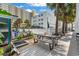 Charming outdoor deck with a picnic table, grill, and lush landscaping at 5409 North Ocean Blvd. # 106/7108, North Myrtle Beach, SC 29582