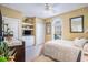 Serene bedroom featuring a queen-size bed, built-in shelving, and a window offering plenty of natural light at 5751 Oyster Catcher Dr. # 315, North Myrtle Beach, SC 29582