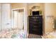 Bedroom with two twin beds, black dresser, and decor that has a coastal theme at 5751 Oyster Catcher Dr. # 315, North Myrtle Beach, SC 29582