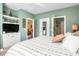 Bright bedroom featuring doors to a bath and closet, and a TV on a white cabinet at 5751 Oyster Catcher Dr. # 315, North Myrtle Beach, SC 29582