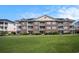 Stately brick building with multiple stories and screened-in porches at 5751 Oyster Catcher Dr. # 315, North Myrtle Beach, SC 29582
