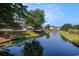 View of grounds with the community buildings in the background at 5751 Oyster Catcher Dr. # 315, North Myrtle Beach, SC 29582