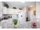 Kitchen with white cabinetry, granite countertops, stainless appliances, and an adjacent doorway at 5751 Oyster Catcher Dr. # 315, North Myrtle Beach, SC 29582