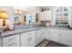 Bright kitchen featuring white cabinets, granite countertops, and stainless steel appliances at 5751 Oyster Catcher Dr. # 315, North Myrtle Beach, SC 29582