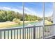 Enjoy the views from this screened-in balcony overlooking the pond and lush landscaping at 5825 Catalina Dr. # 124, North Myrtle Beach, SC 29582