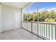 Enjoy the view from this screened-in balcony overlooking the pond with surrounding trees at 5825 Catalina Dr. # 124, North Myrtle Beach, SC 29582