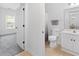 Bright bathroom featuring a combined bathtub shower, single sink vanity and gray towel at 5825 Catalina Dr. # 124, North Myrtle Beach, SC 29582