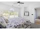Bright bedroom featuring nautical-themed decor, ceiling fan, and views of the outdoor scenery at 5825 Catalina Dr. # 124, North Myrtle Beach, SC 29582
