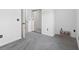 Carpeted room with sliding mirrored closet doors and access to another room at 5825 Catalina Dr. # 124, North Myrtle Beach, SC 29582