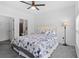 Bright bedroom featuring a ceiling fan and comfortable king-sized bed with easy access to the bathroom at 5825 Catalina Dr. # 124, North Myrtle Beach, SC 29582