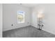 Bedroom featuring neutral carpeting, a window, and a floor lamp at 5825 Catalina Dr. # 124, North Myrtle Beach, SC 29582